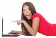 Woman excited with laptop
